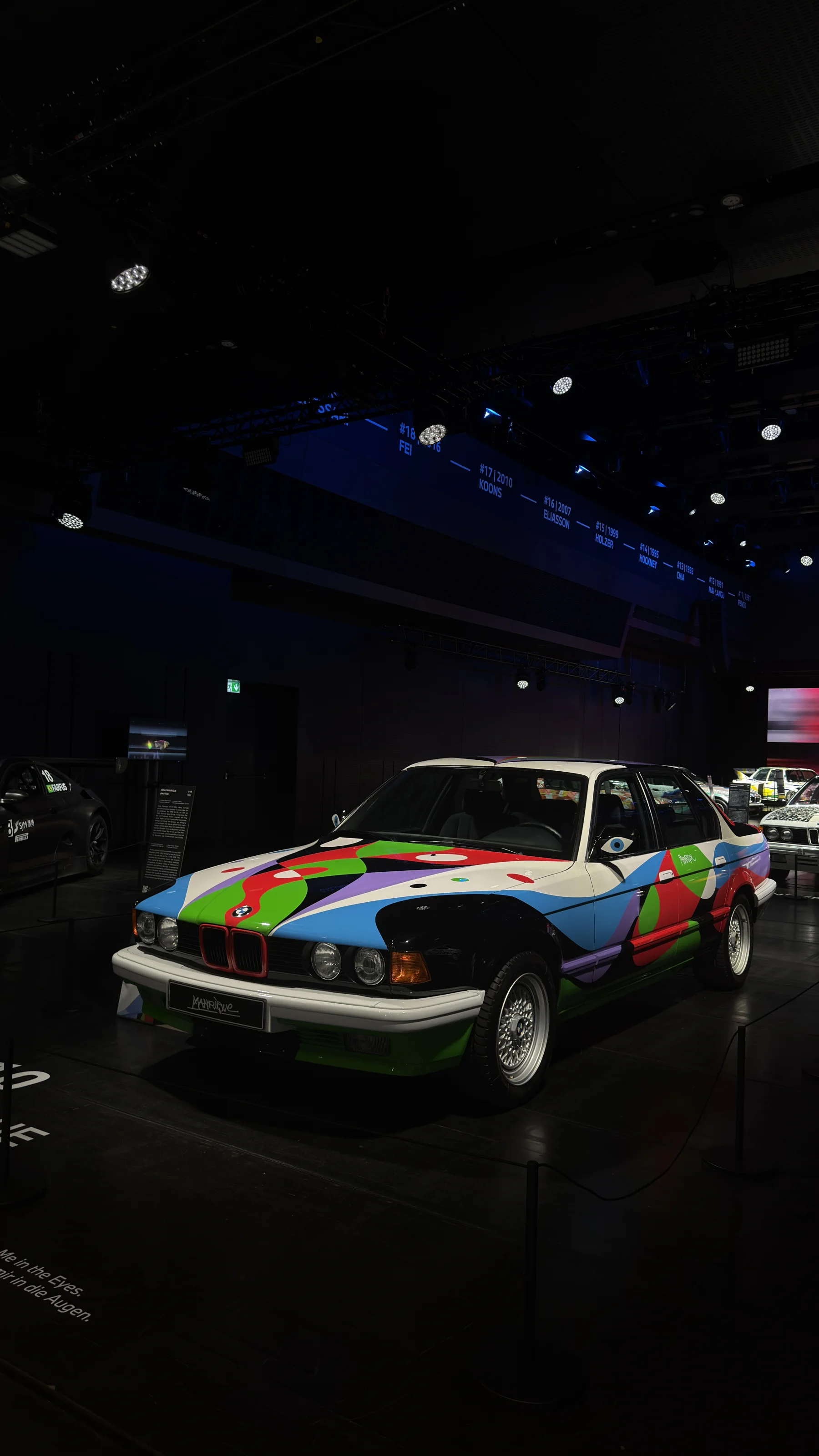 A brightly painted BMW Art Car in the exhibition at BMW Welt